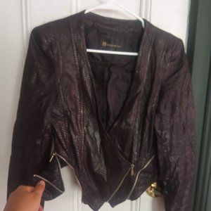 Faux leather jacket with two different reversible zip design